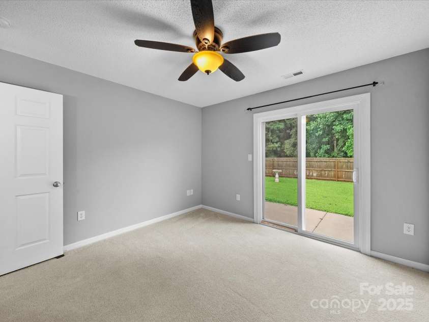 1585 Nathanial Street, Newton, NC 28658.  MLS# CAR4289013, YatesRealty ID 34764. Secondary Bedroom with sliding glass doors to backyard