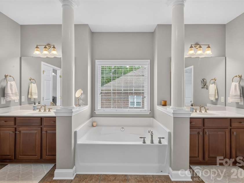 9220 Kensington Forest Drive, Harrisburg, NC 28075.  MLS# CAR4396043, YatesRealty ID 34771. Primary Bathroom