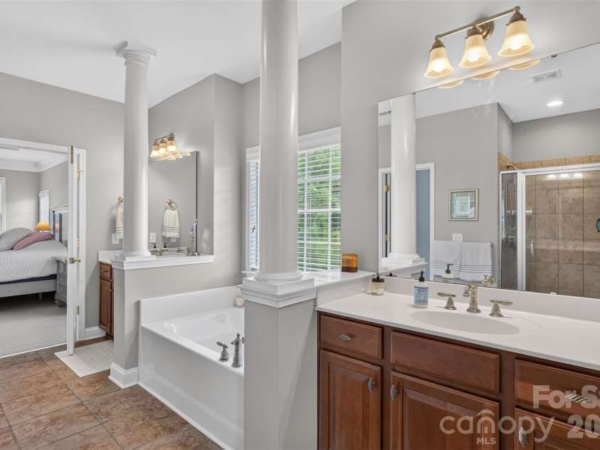 9220 Kensington Forest Drive, Harrisburg, NC 28075.  MLS# CAR4396043, YatesRealty ID 34771. Primary Bathroom