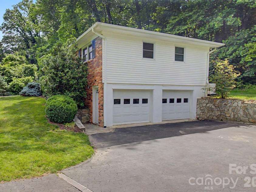 22 Mayfair Drive, Candler, NC 28715.  MLS# CAR4391102, YatesRealty ID 34782. Garage and lower parking