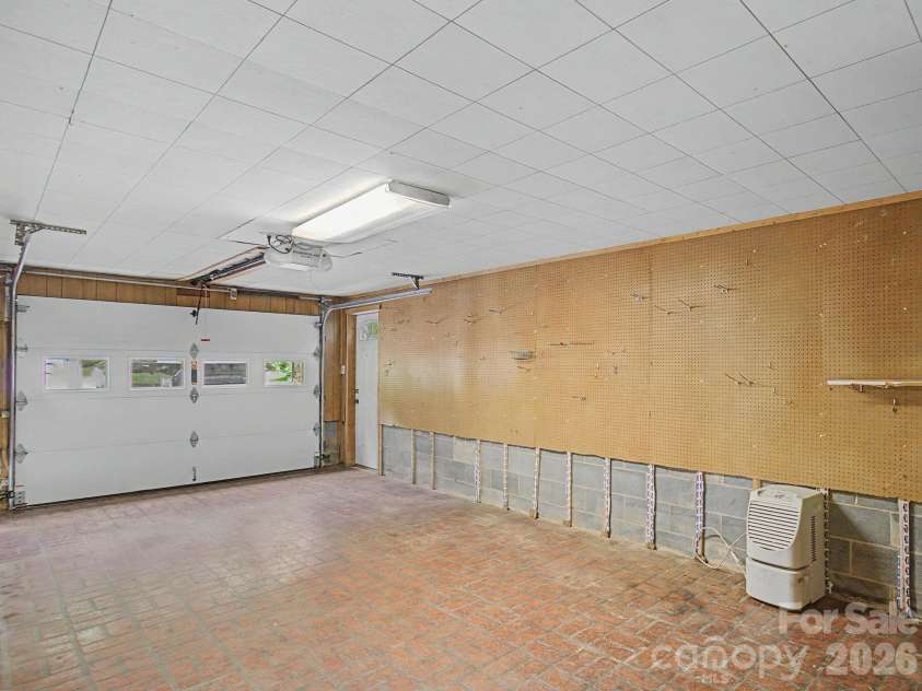 22 Mayfair Drive, Candler, NC 28715.  MLS# CAR4391102, YatesRealty ID 34782. Garage area