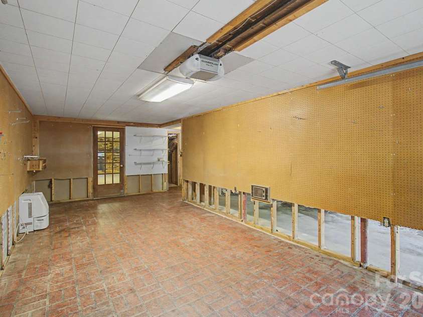 22 Mayfair Drive, Candler, NC 28715.  MLS# CAR4391102, YatesRealty ID 34782. Garage area