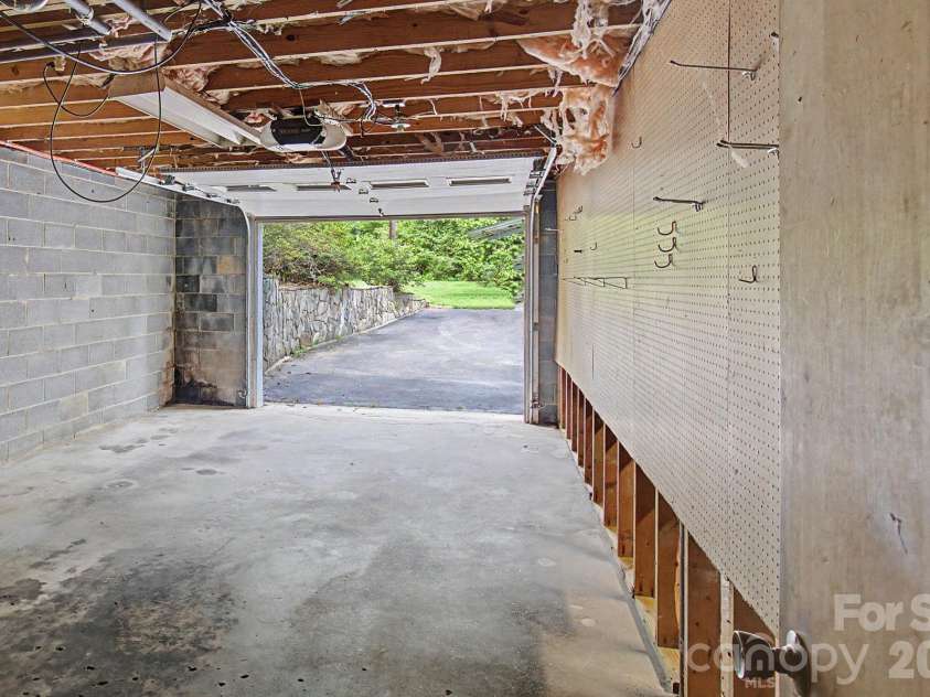 22 Mayfair Drive, Candler, NC 28715.  MLS# CAR4391102, YatesRealty ID 34782. Open Garage Door