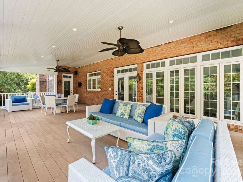 239 Kimberly Road, Davidson, NC 28036.  MLS# CAR4288776, YatesRealty ID 34782. Beautiful covered porch for enjoying the outdoors!
