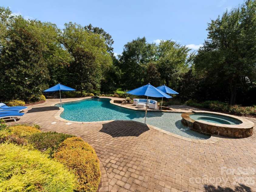239 Kimberly Road, Davidson, NC 28036.  MLS# CAR4288776, YatesRealty ID 34782. Expansive salt water pool with hot tub