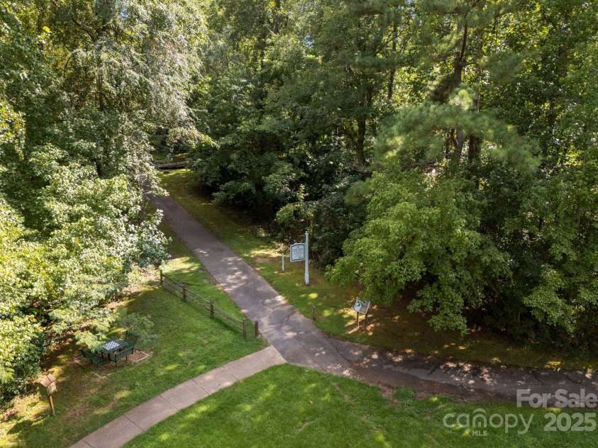 239 Kimberly Road, Davidson, NC 28036.  MLS# CAR4288776, YatesRealty ID 34782. Just a block from the Davidson Nature path... a wonderful paved trail system through the woods!