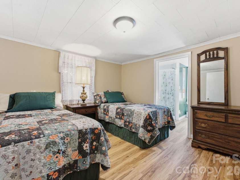 583 Dark Ridge Road, Sylva, NC 28779.  MLS# CAR4394353, YatesRealty ID 34785. Primary bedroom with en suite bath