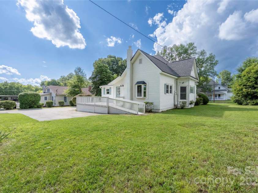 619 Oak Street, Mooresville, NC 28115.  MLS# CAR4274443, YatesRealty ID 34787. Back yard and back porch