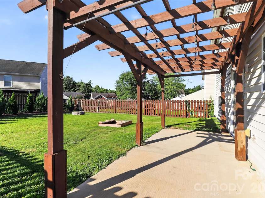 2043 Grimley Lane, Fort Mill, SC 29707.  MLS# CAR4397584, YatesRealty ID 34788. Backyard patio and pergola 