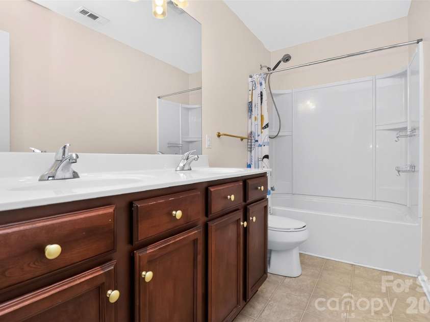 2043 Grimley Lane, Fort Mill, SC 29707.  MLS# CAR4397584, YatesRealty ID 34788. Full bathroom with dual vanities 