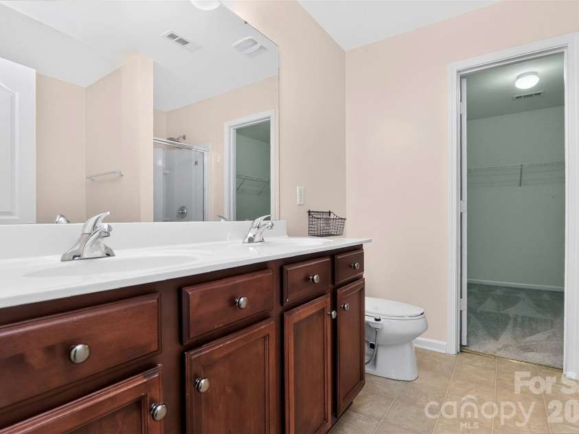 2043 Grimley Lane, Fort Mill, SC 29707.  MLS# CAR4397584, YatesRealty ID 34788. Primary bathroom, dual vanities 