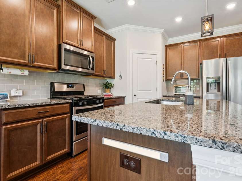 3850 Longmore Lane, Kannapolis, NC 28081.  MLS# CAR4394364, YatesRealty ID 34789. Kitchen with walk in pantry