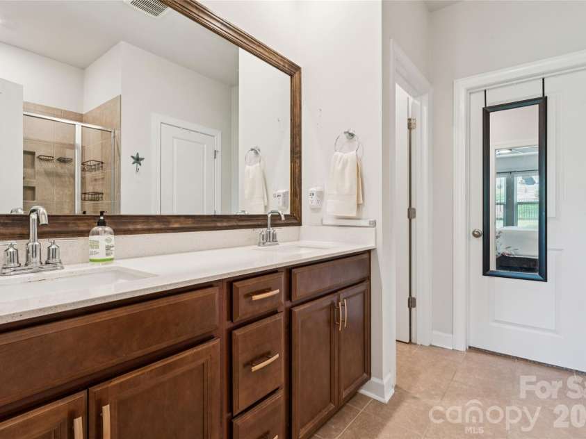3850 Longmore Lane, Kannapolis, NC 28081.  MLS# CAR4394364, YatesRealty ID 34789. Primary bathroom-dual vanity with custom mirror