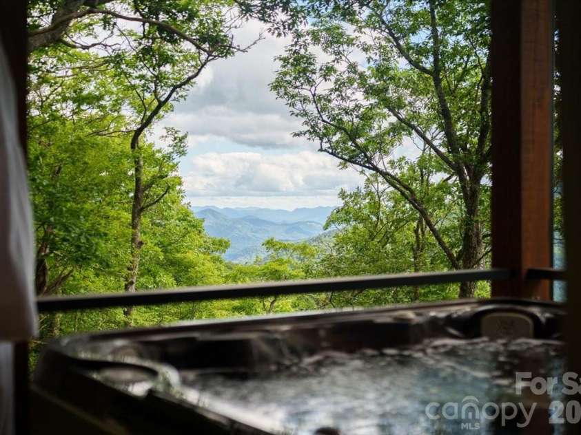 241 Ataya Trail, Maggie Valley, NC 28751.  MLS# CAR4397152, YatesRealty ID 34790. Hot tub with view