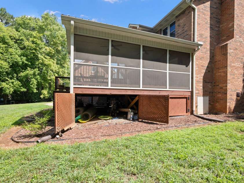 1307 Bennington Drive, Concord, NC 28027.  MLS# CAR4394674, YatesRealty ID 34794. Add'l storage under porch