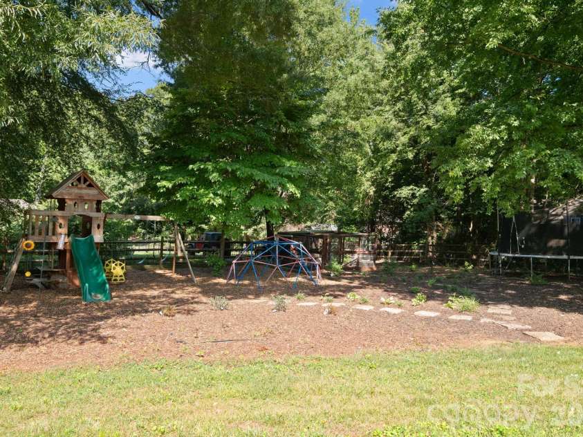 1307 Bennington Drive, Concord, NC 28027.  MLS# CAR4394674, YatesRealty ID 34794. Shaded space to relax or play!