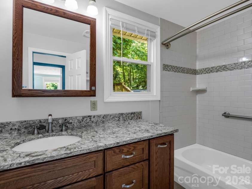 102 Little House Road, Tryon, NC 28782.  MLS# CAR4395384, YatesRealty ID 34796. Bathroom on the upper level