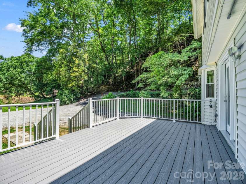102 Little House Road, Tryon, NC 28782.  MLS# CAR4395384, YatesRealty ID 34796. Large deck for entertaining, grilling or hanging out