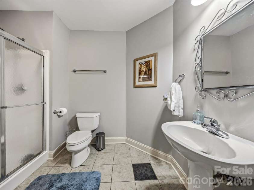 840 and 856 Stoney Stream Lane, Arden, NC 28704.  MLS# CAR4396084, YatesRealty ID 34812. The 3/4 bath on the lower floor