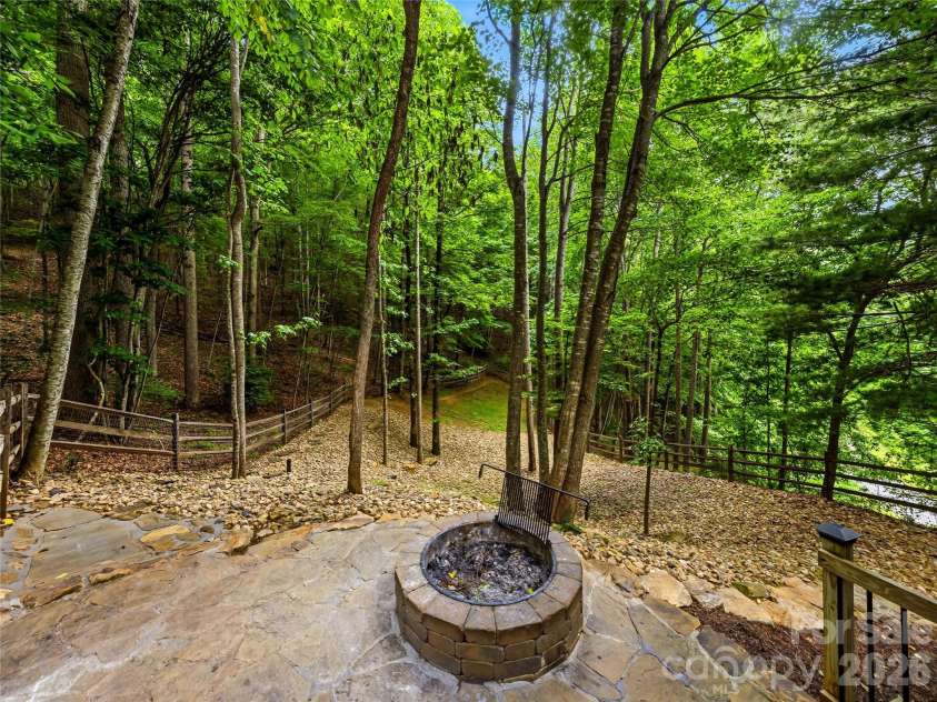 840 and 856 Stoney Stream Lane, Arden, NC 28704.  MLS# CAR4396084, YatesRealty ID 34812. The firepit is  few steps away form the back deck