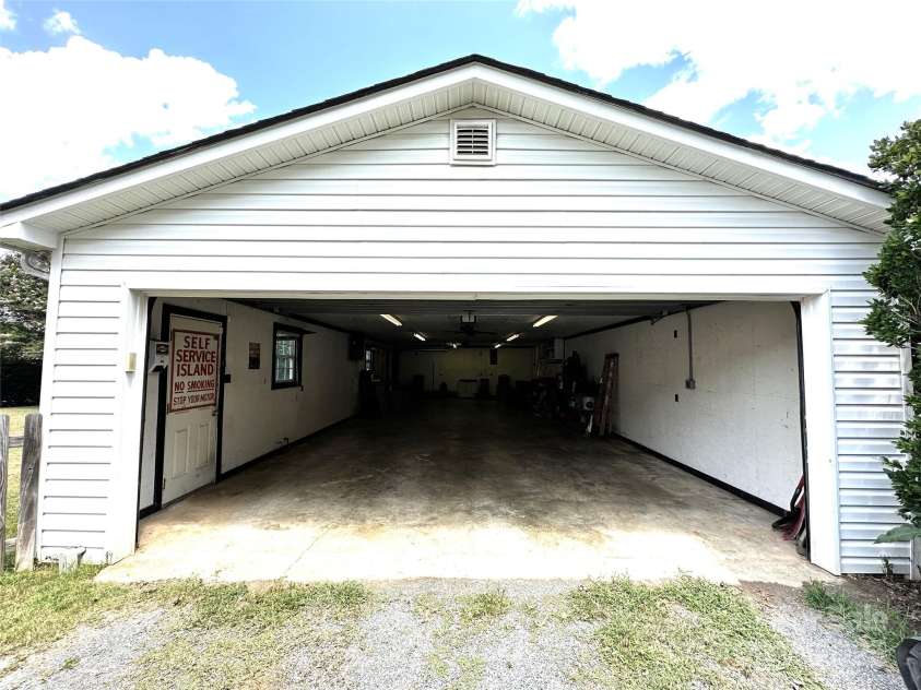 706 Sides Street, Rockwell, NC 28138.  MLS# CAR4283920, YatesRealty ID 34813. 24' x 50' garage with double garage door on front and single garage door on the side.