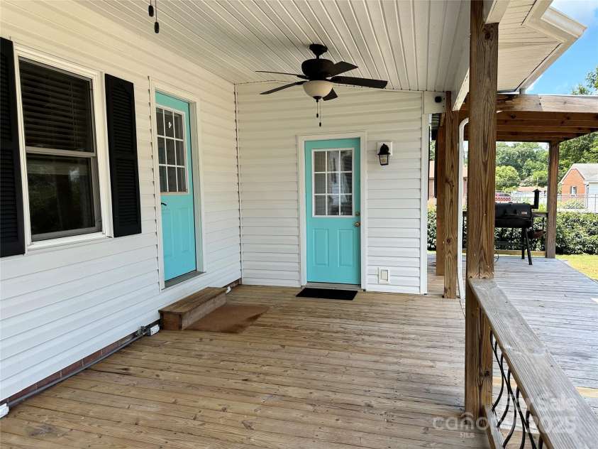 706 Sides Street, Rockwell, NC 28138.  MLS# CAR4283920, YatesRealty ID 34813. Walking onto the back deck