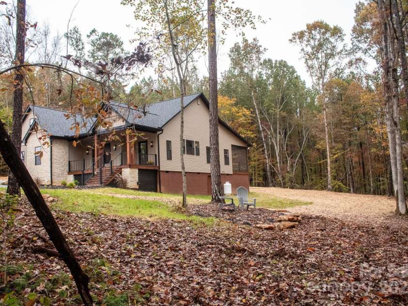 110 Rupard Road, Statesville, NC 28625.  MLS# CAR4232125, YatesRealty ID 34816. Chairs overlooking the creek
