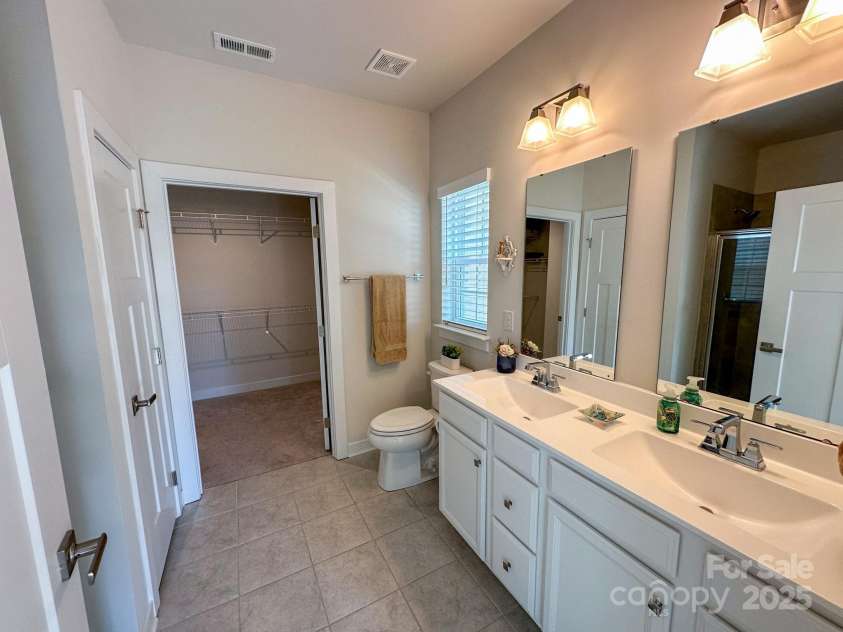 5047 Summer Surprise Lane, Charlotte, NC 28215.  MLS# CAR4219026, YatesRealty ID 3482. Primary bathroom with double sink vanity
