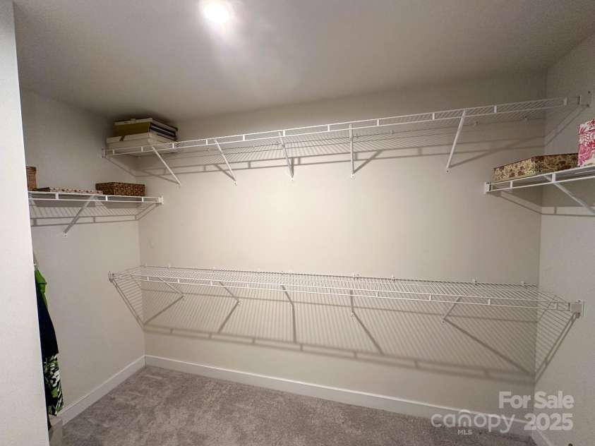 5047 Summer Surprise Lane, Charlotte, NC 28215.  MLS# CAR4219026, YatesRealty ID 3482. Primary bedroom walk-in closet