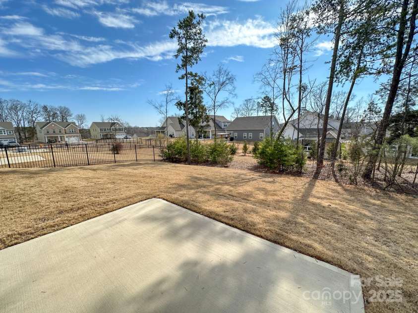 5047 Summer Surprise Lane, Charlotte, NC 28215.  MLS# CAR4219026, YatesRealty ID 3482. Property line extends beyond tree line.