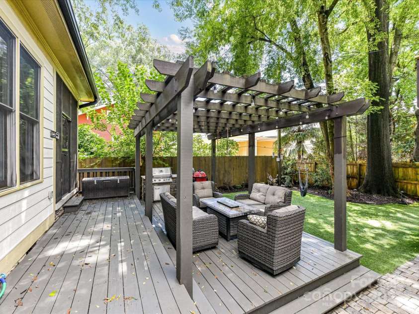 1716 Bay Street, Charlotte, NC 28204.  MLS# CAR4289594, YatesRealty ID 34826. Fabulous, private, fenced back yard with tiered deck/pergola & in ground gas grill for plenty of space to relax or entertain!