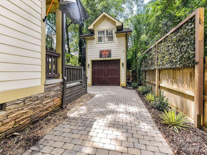 1716 Bay Street, Charlotte, NC 28204.  MLS# CAR4289594, YatesRealty ID 34826. Paver driveway leads to 1 car garage with ensuite apartment above!