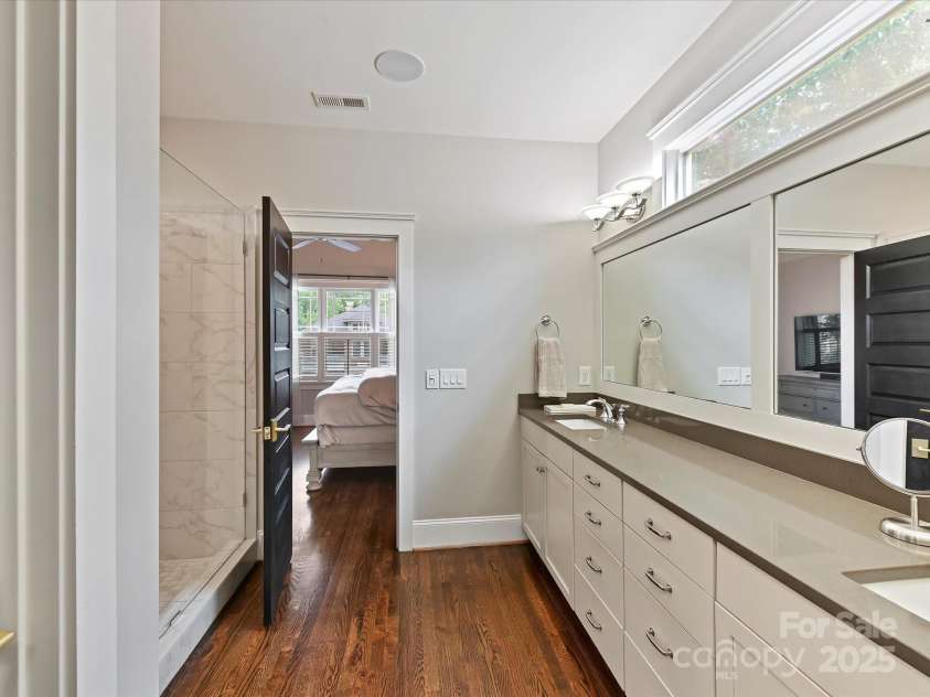 1716 Bay Street, Charlotte, NC 28204.  MLS# CAR4289594, YatesRealty ID 34826. Primary Bath features dual vanity, large, tiled walk in shower, separate water closet & hardwood floors!