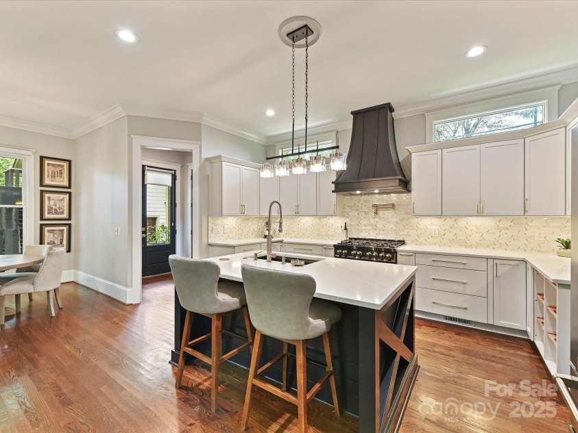 1716 Bay Street, Charlotte, NC 28204.  MLS# CAR4289594, YatesRealty ID 34826. Remodeled, Gourmet Kitchen features quartz counters, Zline appliances, custom tile back splash, spacious island, 6 burner gas stove with pot filler, hood system & ample cabinetry for storage!
