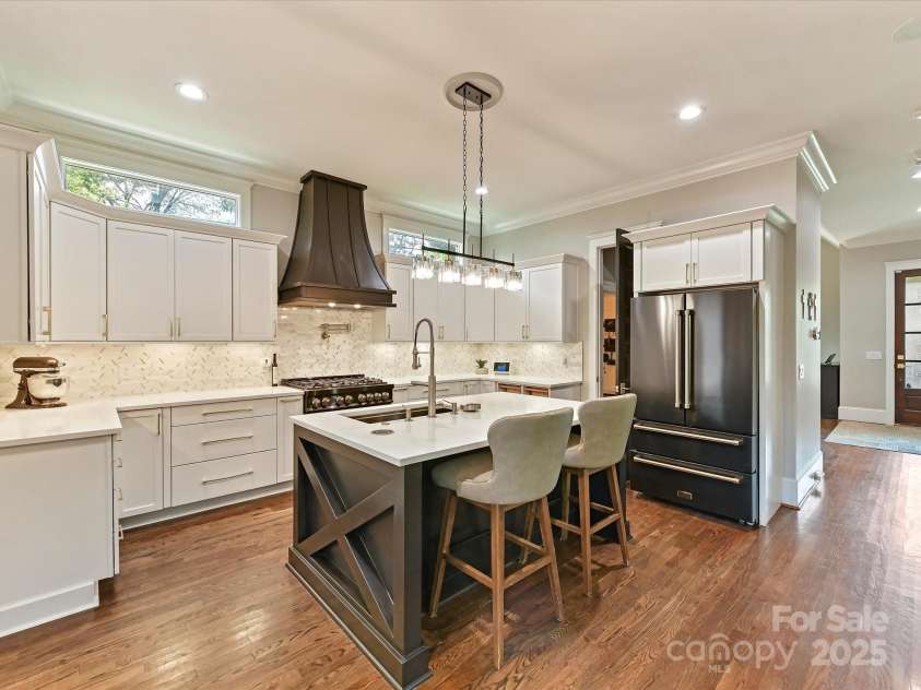 1716 Bay Street, Charlotte, NC 28204.  MLS# CAR4289594, YatesRealty ID 34826. Remodeled, Gourmet Kitchen features quartz counters, Zline appliances, custom tile back splash, spacious island, 6 burner gas stove with pot filler, hood system & ample cabinetry for storage!
