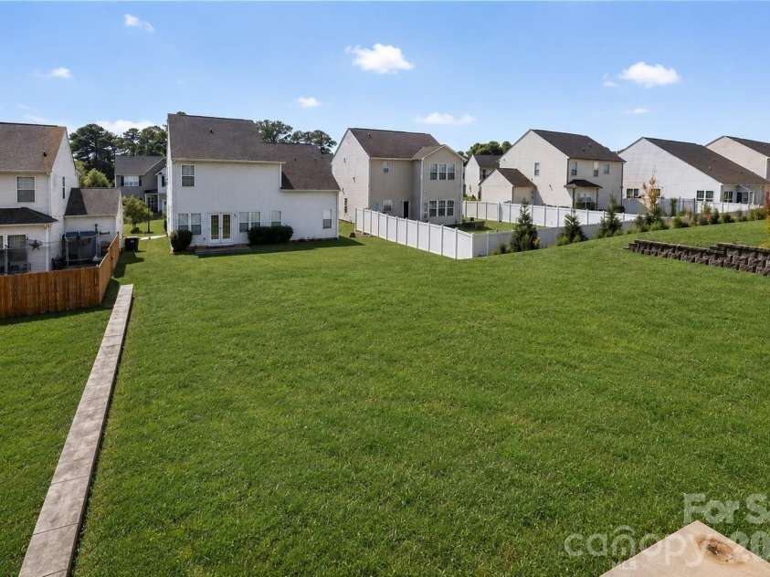 178 Fesperman Circle, Troutman, NC 28166.  MLS# CAR4400193, YatesRealty ID 34835. Backyard with grass edited