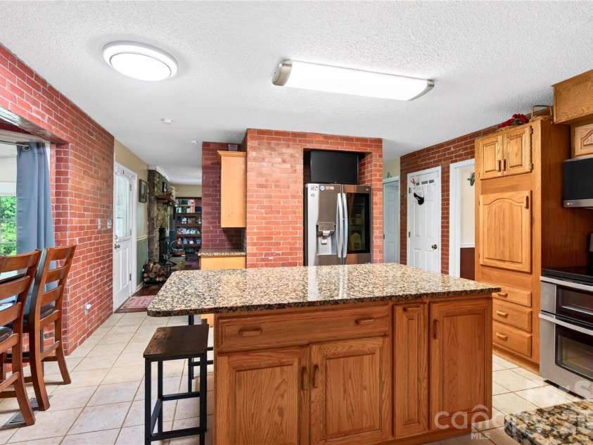 10 Old Turnpike Road, Mills River, NC 28759.  MLS# CAR4399387, YatesRealty ID 34836. Kitchen & Pull-up Seating