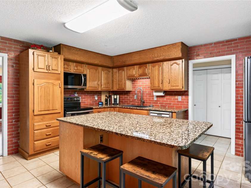 10 Old Turnpike Road, Mills River, NC 28759.  MLS# CAR4399387, YatesRealty ID 34836. Kitchen w/ Island