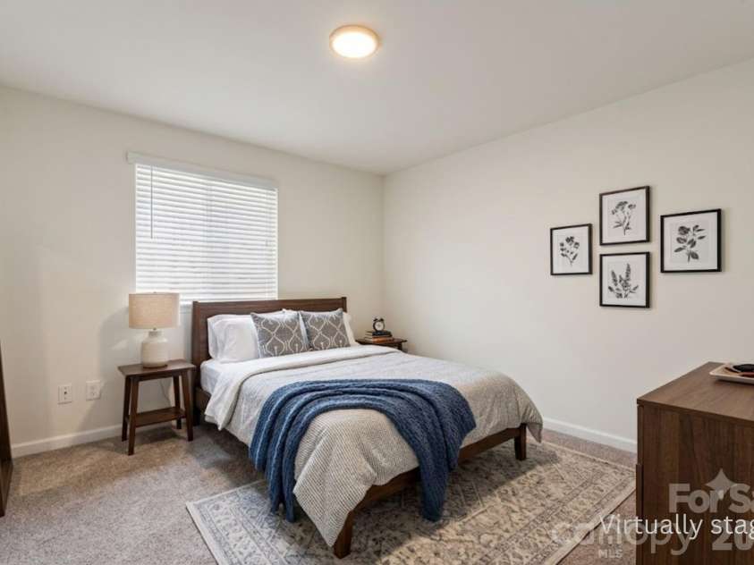 6443 Prosperity Church Road, Charlotte, NC 28269.  MLS# CAR4399263, YatesRealty ID 34840. Bedroom #5 on lower floor virtually staged to give you design ideas