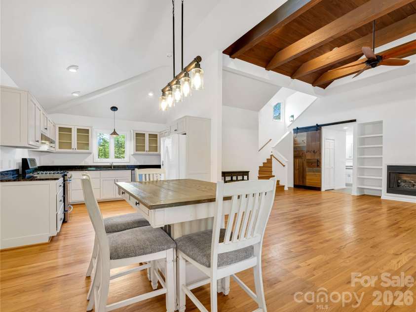 711 Meadow Crest Road, Tryon, NC 28782.  MLS# CAR4399879, YatesRealty ID 34861. Open floor plan with kitchen, dining area and vaulted living space with tons of light.
