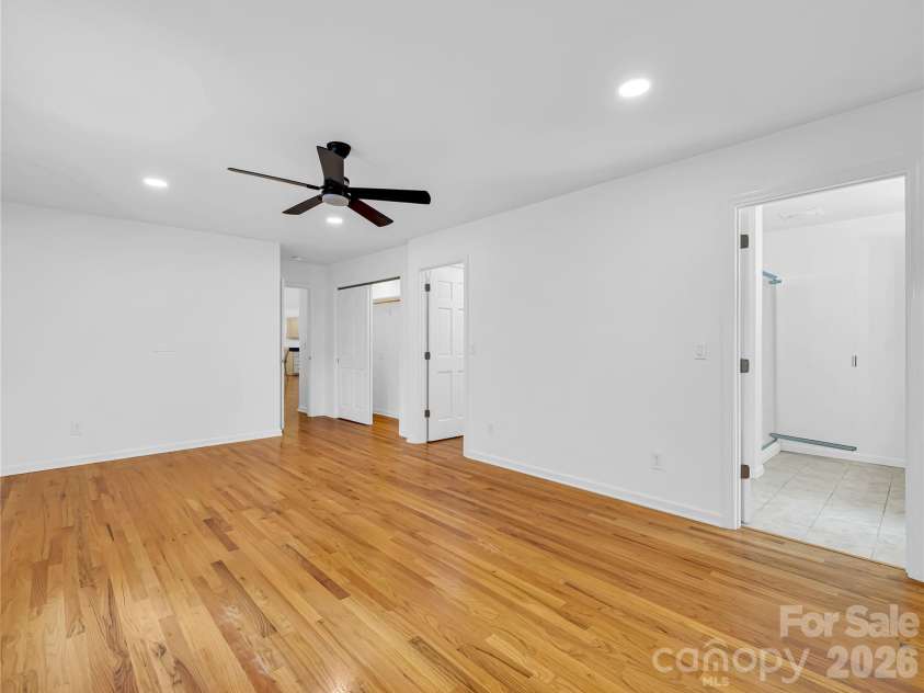 711 Meadow Crest Road, Tryon, NC 28782.  MLS# CAR4399879, YatesRealty ID 34861. Primary bedroom with en suite full bath and 2 closets.