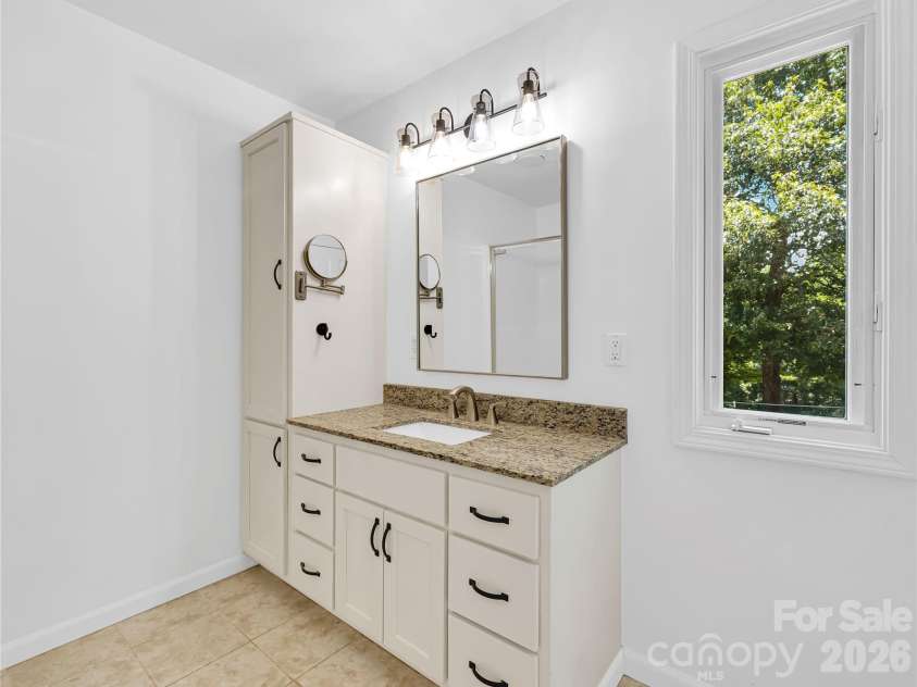 711 Meadow Crest Road, Tryon, NC 28782.  MLS# CAR4399879, YatesRealty ID 34861. Primary en suite full bath.