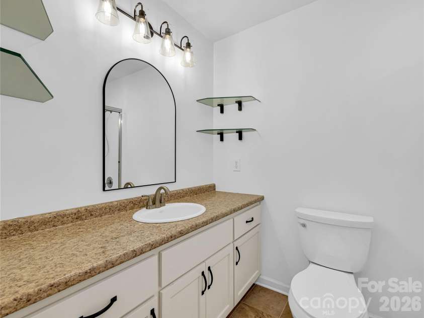 711 Meadow Crest Road, Tryon, NC 28782.  MLS# CAR4399879, YatesRealty ID 34861. Second full bath on main level next to the second bedroom.