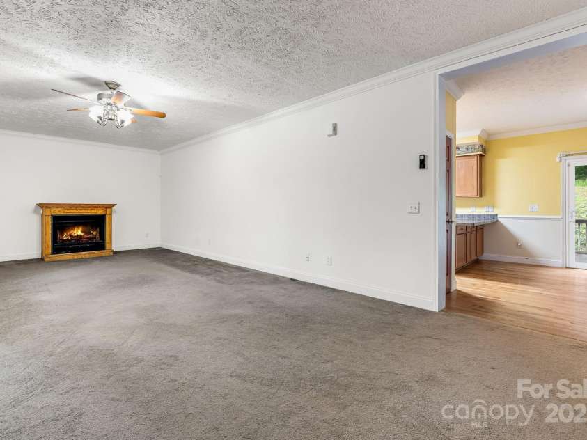 163 Terrace Field Trail, Flat Rock, NC 28731.  MLS# CAR4295496, YatesRealty ID 34865. Living room with gas logs
