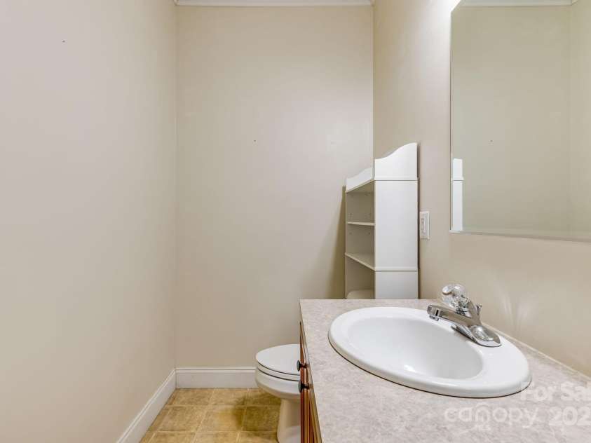 163 Terrace Field Trail, Flat Rock, NC 28731.  MLS# CAR4295496, YatesRealty ID 34865. Main level half bath.