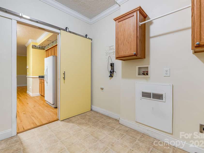 163 Terrace Field Trail, Flat Rock, NC 28731.  MLS# CAR4295496, YatesRealty ID 34865. Main Level laundry room.