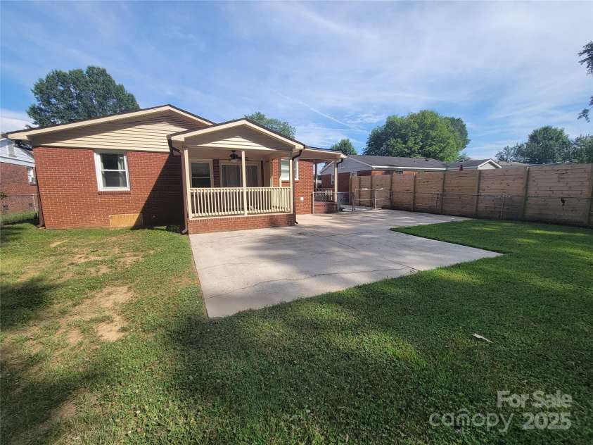 1415 Orvis Street, Charlotte, NC 28216.  MLS# CAR4295107, YatesRealty ID 34867. REAR YARD & PATIO