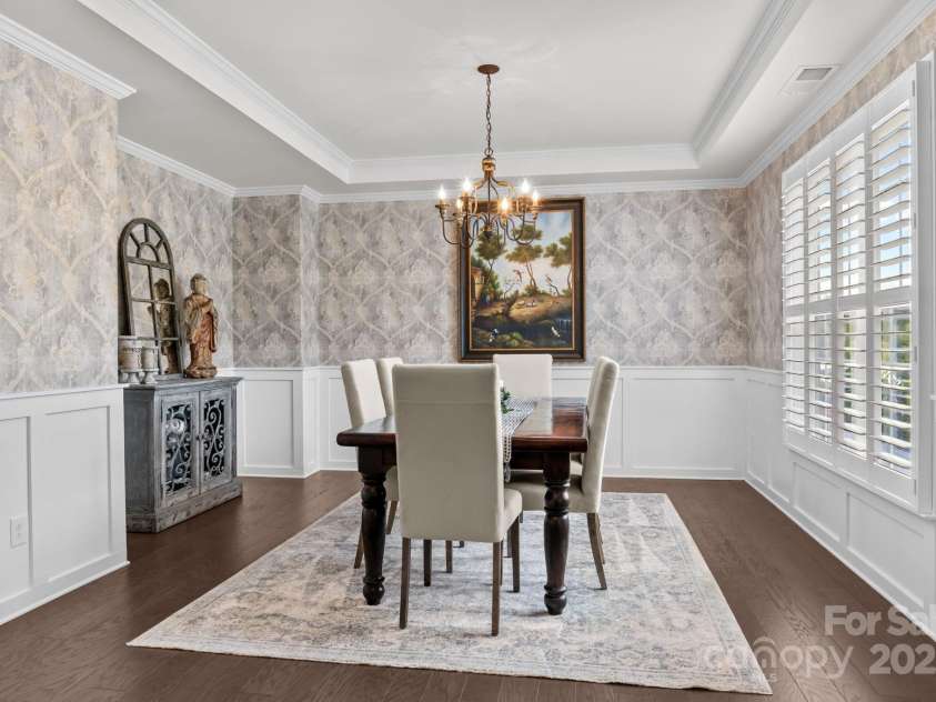 12710 Longford Crossing Place, Huntersville, NC 28078.  MLS# CAR4294654, YatesRealty ID 34868. Formal dining w/ tray ceiling, custom wallpaper & moldings
