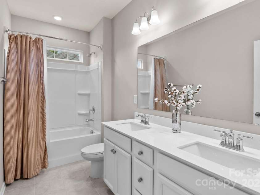 12710 Longford Crossing Place, Huntersville, NC 28078.  MLS# CAR4294654, YatesRealty ID 34868. Hall bathroom upstairs w/ dual sinks
