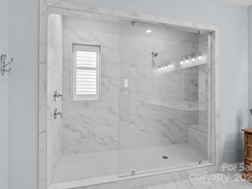 12710 Longford Crossing Place, Huntersville, NC 28078.  MLS# CAR4294654, YatesRealty ID 34868. Primary shower is incredible! Dual showerheads, bench & niche